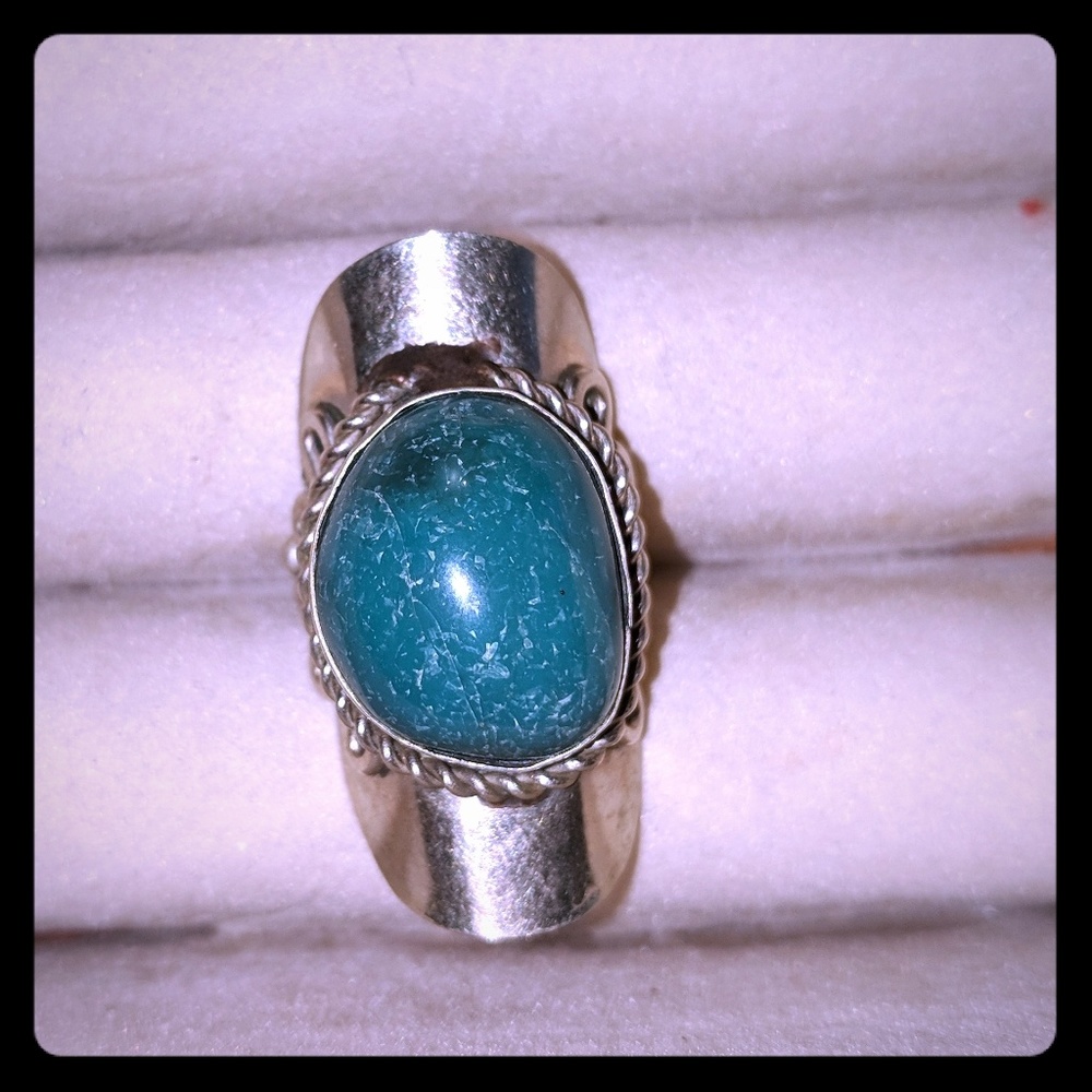 Silver ring with green stone